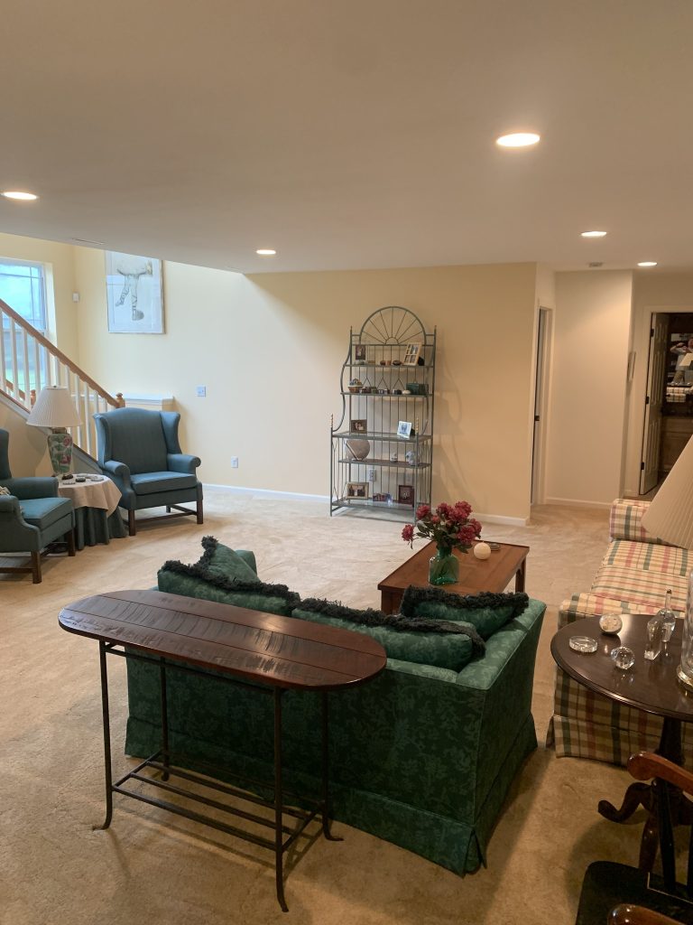 Restored basement after water damage from kitchen